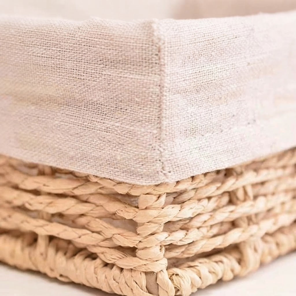 Close-up of beige fabric liner corner on woven willow straw storage basket