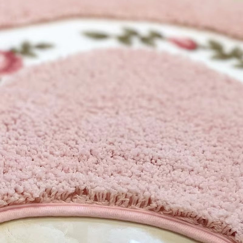 Close-up of pink textured bath mat pile with pink edge trim