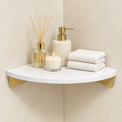 White marble corner floating shelf with gold supports and bath accessories on display