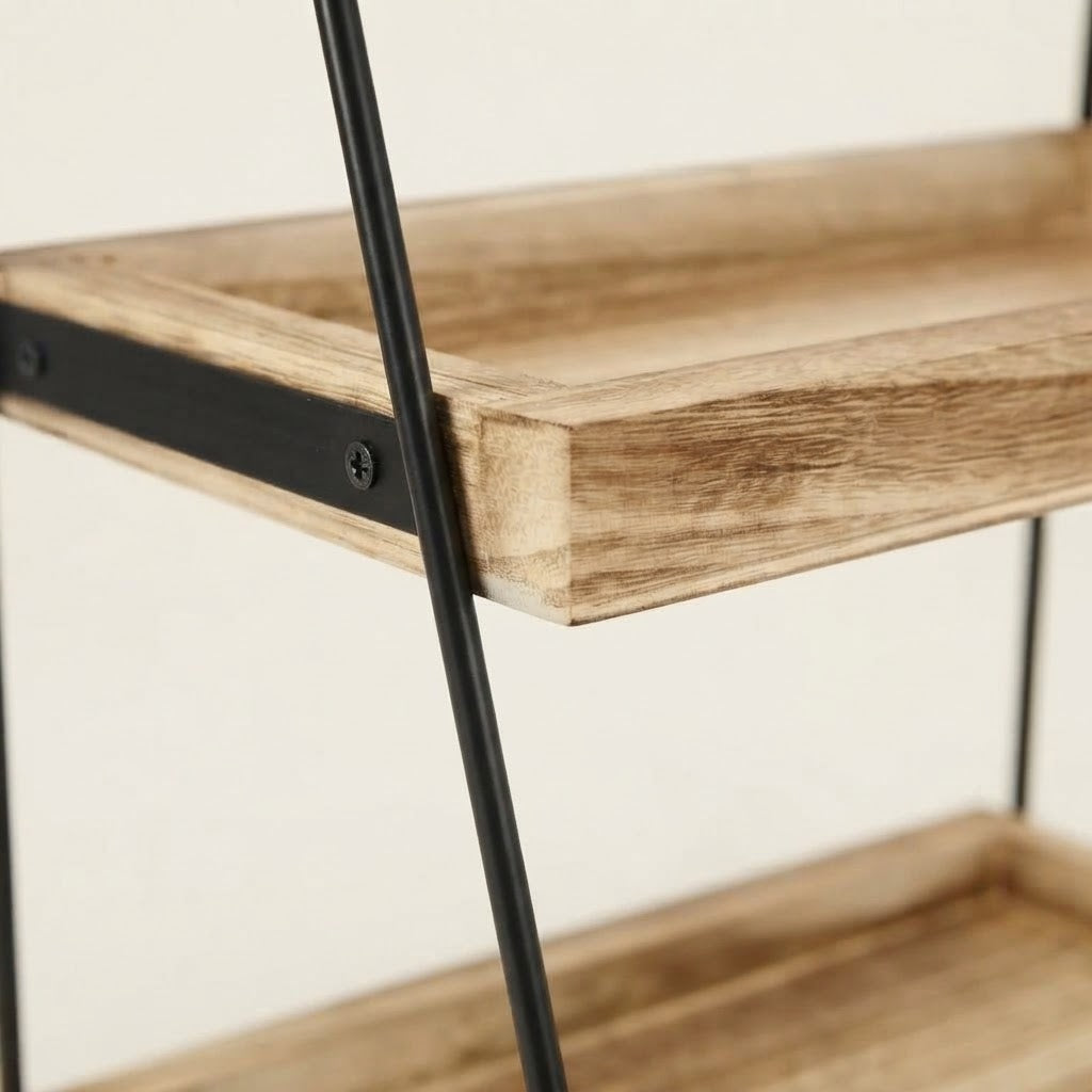 Close-up of light wood shelf edges on two-tier kitchen rack with black frame