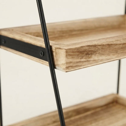Close-up of light wood shelf edges on two-tier kitchen rack with black frame
