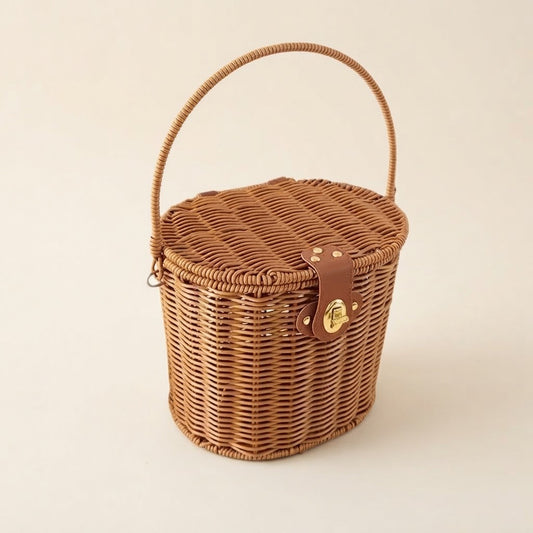 Woven faux rattan storage picnic basket with arched handle and leather-look front strap