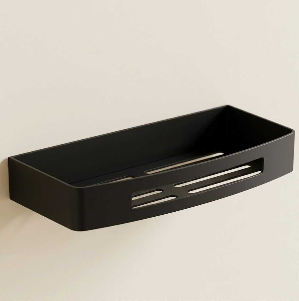 Black stainless steel wall shower caddy tray with drainage slots, single tier.