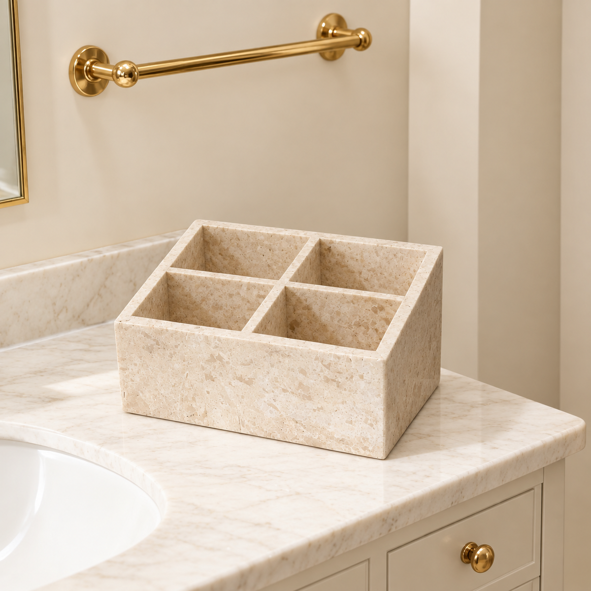 Travertine-style makeup organizer with four compartments on countertop, light beige.