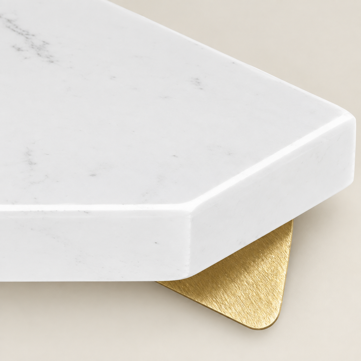 White marble shelf corner with gold mounting bracket under the overhang