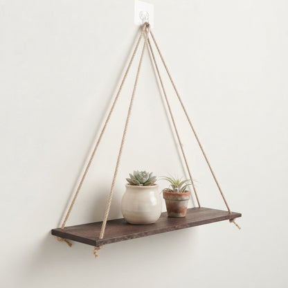 Hanging wooden rope shelf with dark wood plank and three long tan braided cords