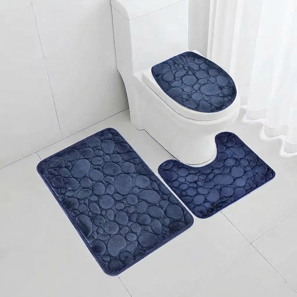 Navy microfibre non-slip bath mat set with three matching bathroom rugs.