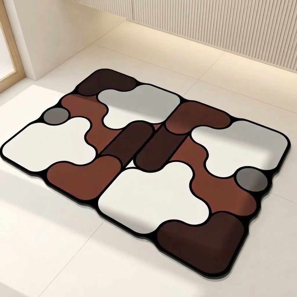 Brown and white irregular non-slip bath mat with gray accents and black edging
