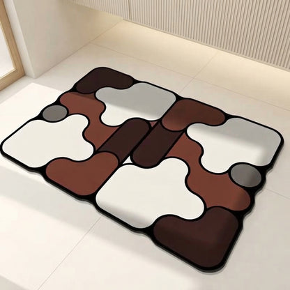 Brown and white irregular non-slip bath mat with gray accents and black edging