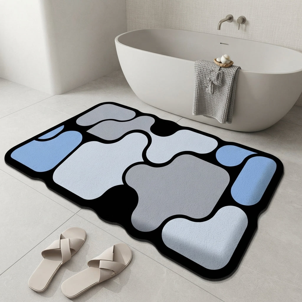 Abstract non-slip bath mat with blue and white irregular shapes on dark border