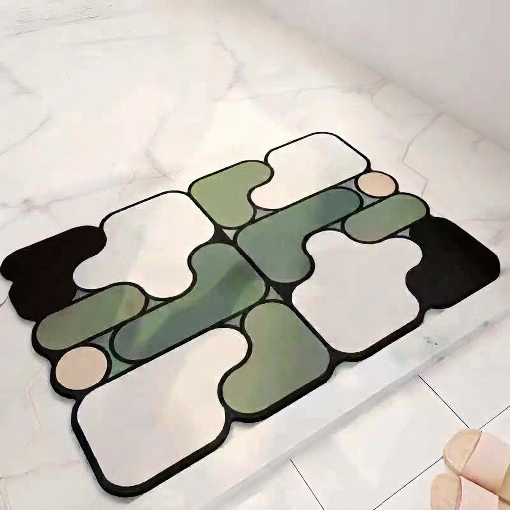 Abstract irregular bath mat with green, white, and dark border non-slip pattern