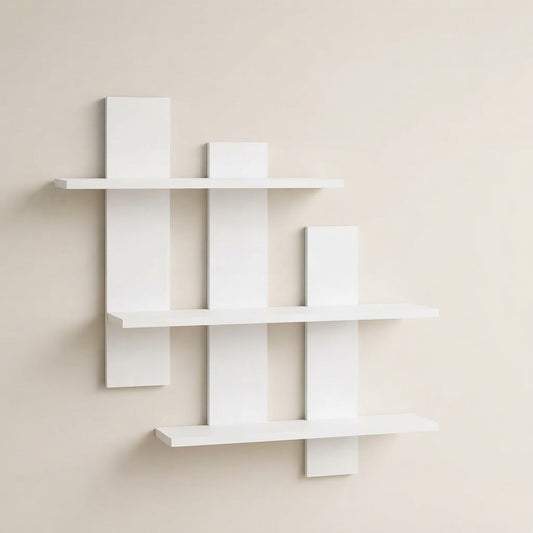 White asymmetrical three-tier floating wall shelf, side view of staggered tiers
