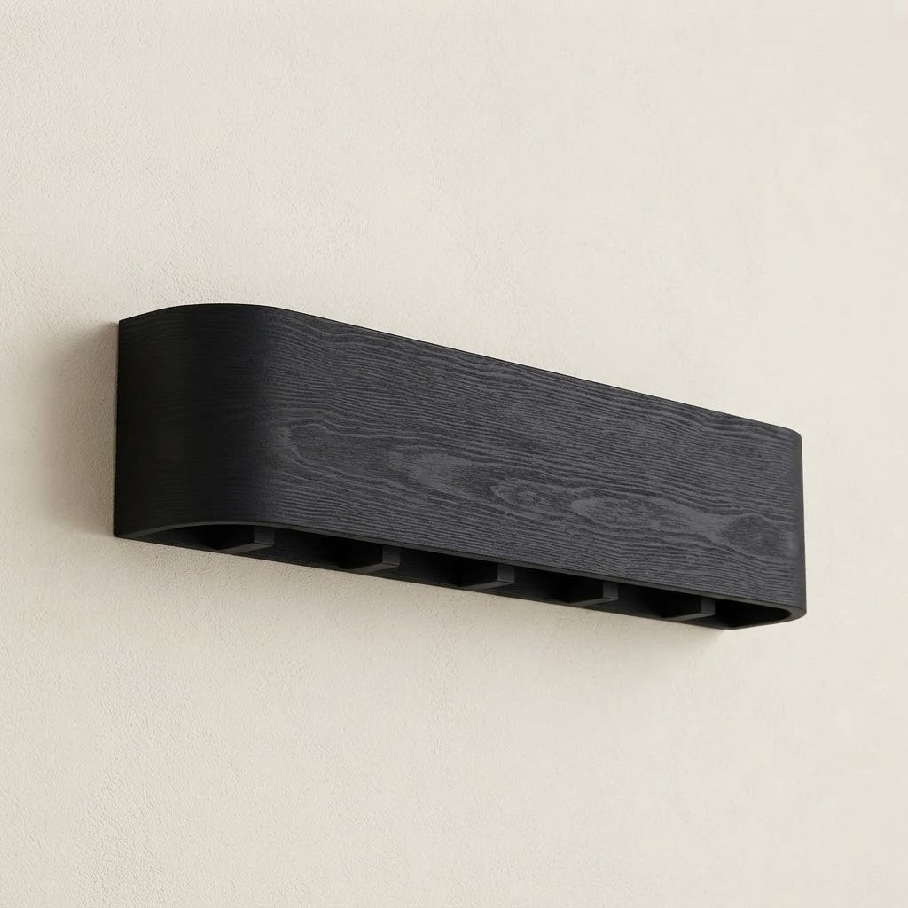 Wall-mounted concealed hook rail with dark wood front and hidden black hook slots