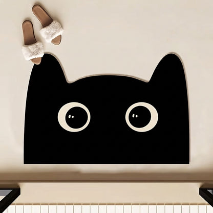 Black cat-shaped bath mat with cute face and large white eyes, rounded top