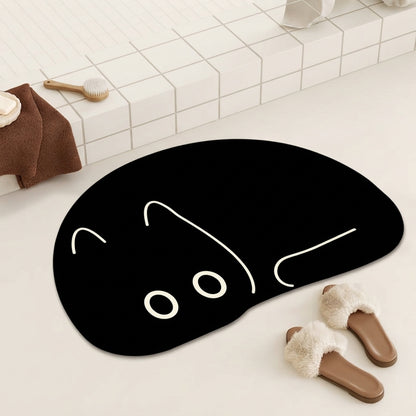 Black cat-shaped bath mat with curled peeking cat outline and whisker lines