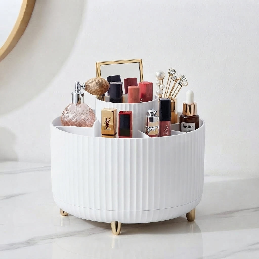 White ribbed 360 rotating makeup organizer with gold feet holding assorted cosmetics
