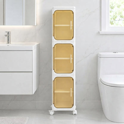 Slim rolling bathroom storage cabinet with three doors closed and amber interior shelves