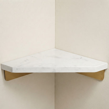 White marble corner floating shelf with gold supports, angled view of rounded tabletop