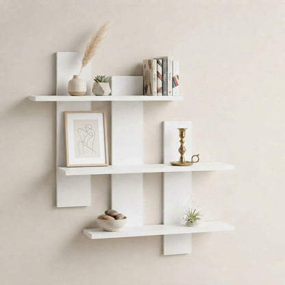 White asymmetrical three-tier floating wall shelf with multiple staggered tiers