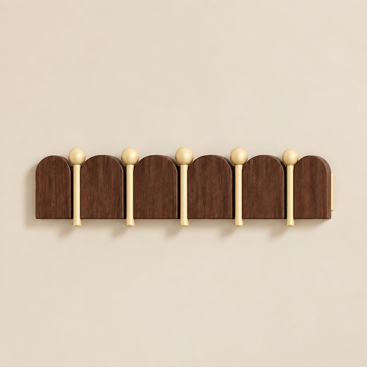 Solid wood arched coat rack with 5 rounded top hooks and light gold ball knobs