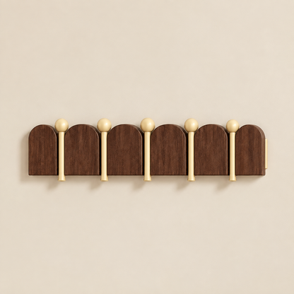 Solid wood arched coat rack with 5 rounded top hooks and light gold ball knobs