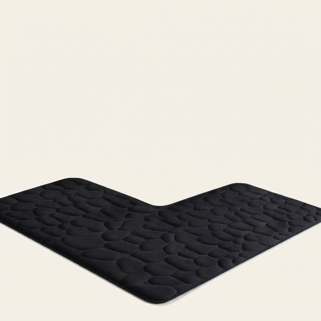 L-shaped non-slip bath mat with pebble embossing, black; V-corner view