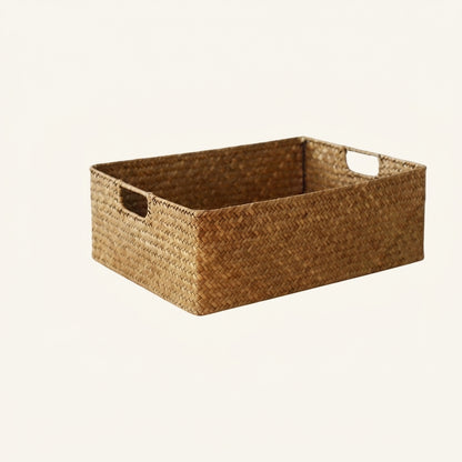 Two-tone woven seagrass basket with handles, empty