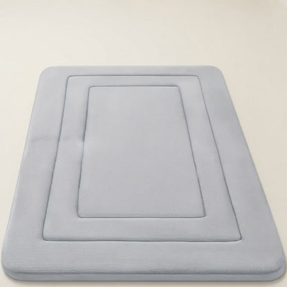 Light grey soft cushioned non-slip bath mat with recessed square design