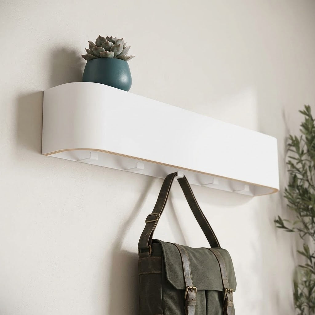 Wall-mounted concealed hook rail with white wood front and hidden hook slots