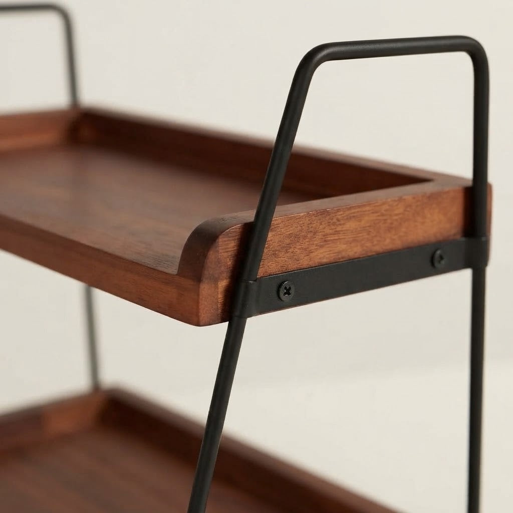 Close-up of dark wooden top shelf on two-tier rack with black metal frame