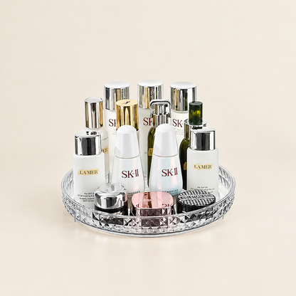 Three-tier rotating makeup organizer with clear stand and mirrored diamond-pattern rim