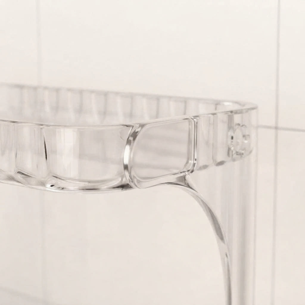 Clear acrylic bathroom countertop organiser with front compartments and curved side wall