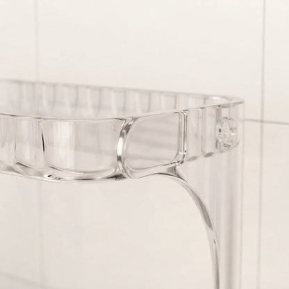 Clear acrylic bathroom countertop organiser with front compartments and curved side wall