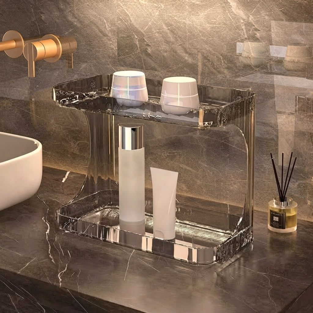 Clear acrylic bathroom countertop organiser with open two-level trays for toiletries