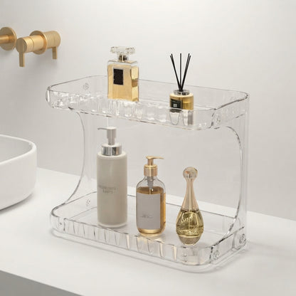 Clear acrylic bathroom countertop organiser with two-tier storage and front bottle slots