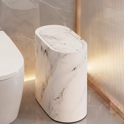 White marble bathroom bin with oval pop-up lid, top view