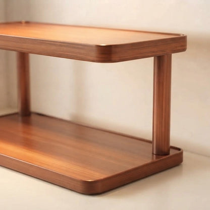 Light brown bamboo two-tier shelf corner with rounded top and bottom shelves.