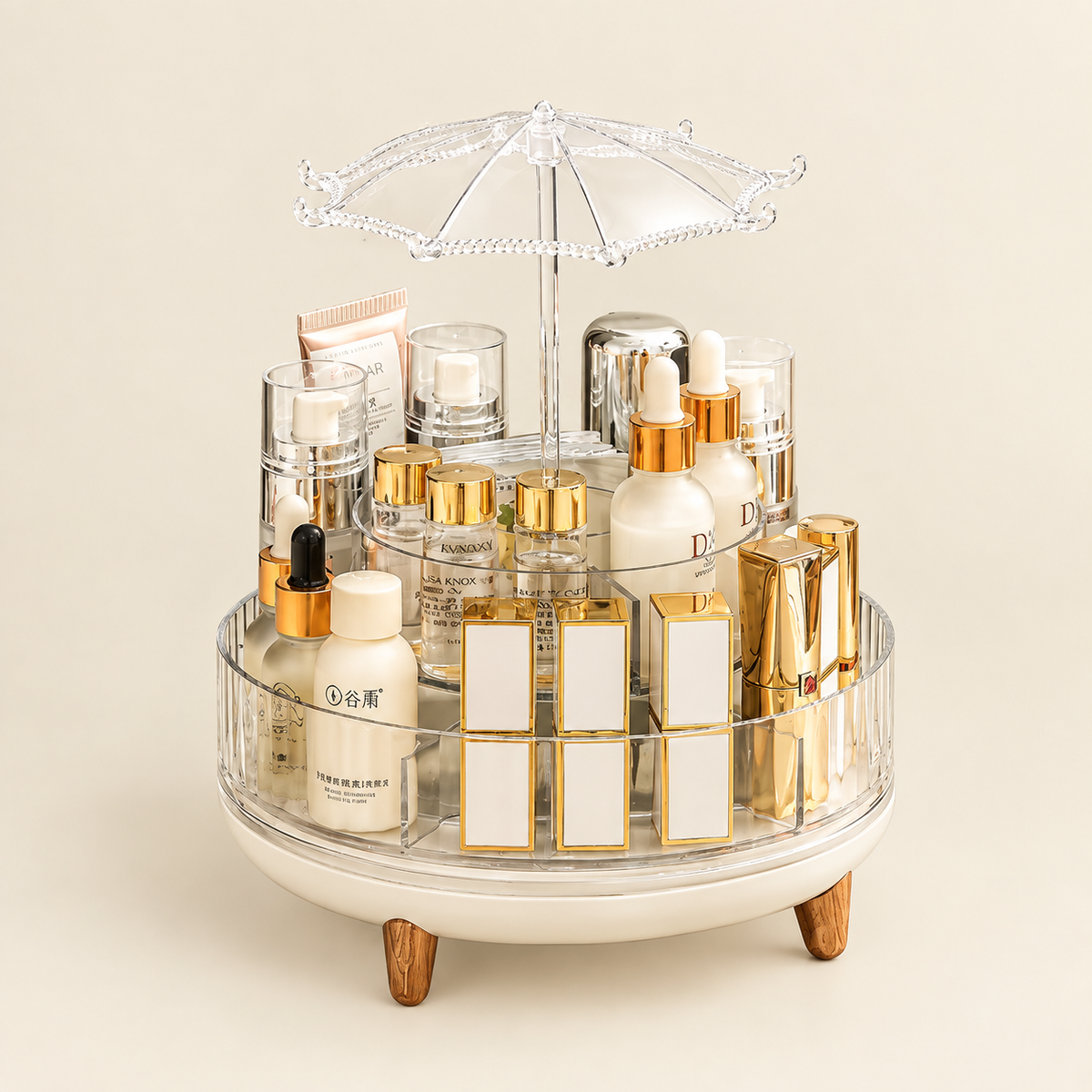 Rotating multi-tier makeup organizer with clear acrylic tiers and gold umbrella-style cover