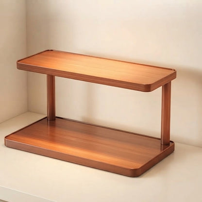 Light brown bamboo two-tier countertop shelf with open shelves and rounded rectangular edges.
