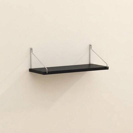 Bracket-mounted floating wall shelf with black shelf and clear metal supports