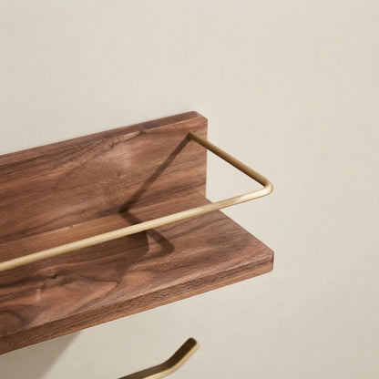 Brown solid wood floating shelf corner with gold-tone rail and smooth back edge
