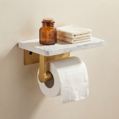 Marble-look toilet roll holder with curved brushed gold arm holding a toilet roll