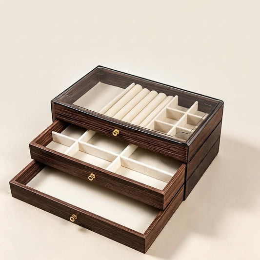 Walnut wooden jewellery box with open lid and white padded compartments for rings and bracelets