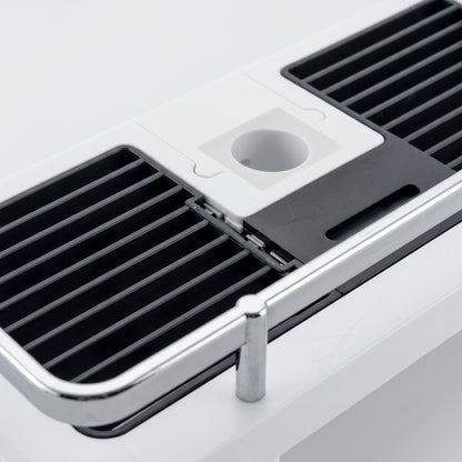 White shower rail caddy with black slotted base and central round bottle holder