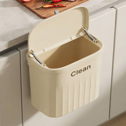 Beige two-way hanging cupboard door bin with lid open showing empty interior