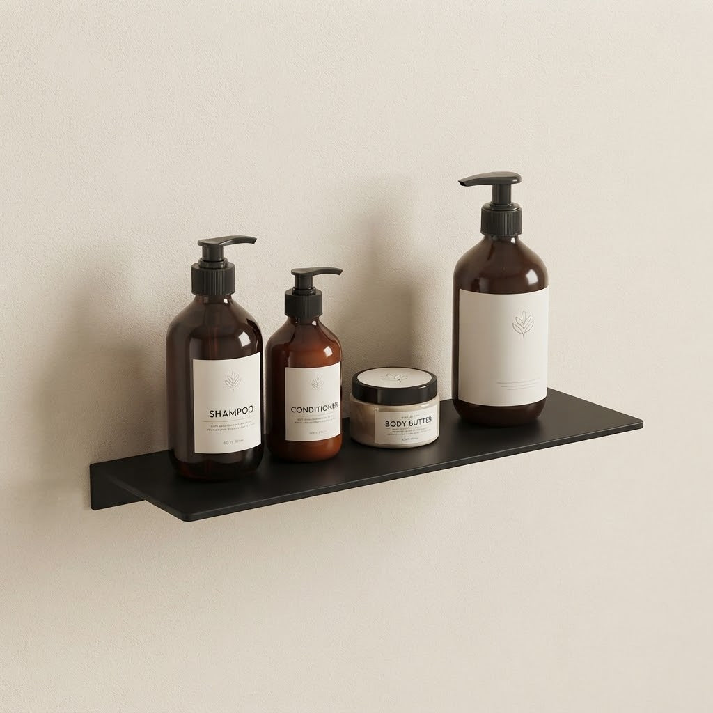 Black floating stainless steel shelf with pump bottles and body jar on the ledge.