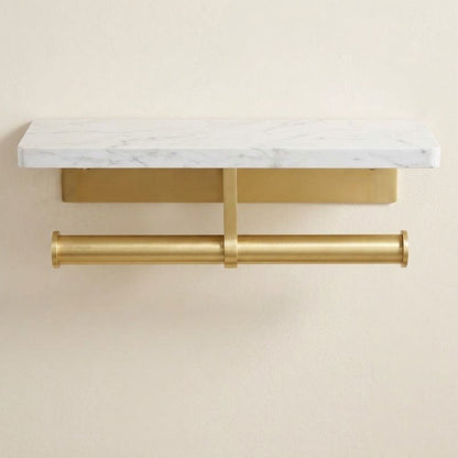 Marble-look toilet roll holder with double cylindrical brushed gold bars and white shelf