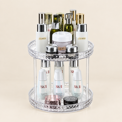 Rotating makeup organizer with two stacked clear tiers and mirrored diamond-pattern rim
