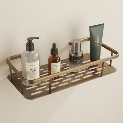 Single-tier solid brass slatted shower caddy holding toiletries on the shelf