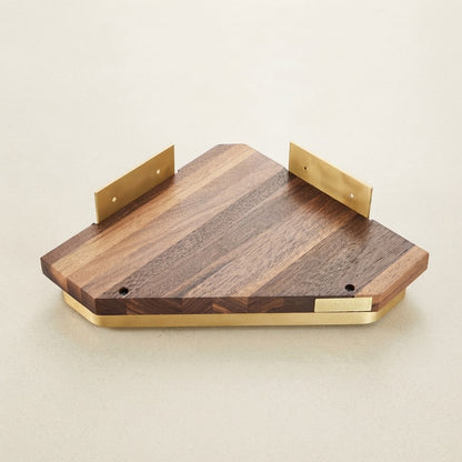 Walnut wood floating corner shelf with guard rails and two gold end supports